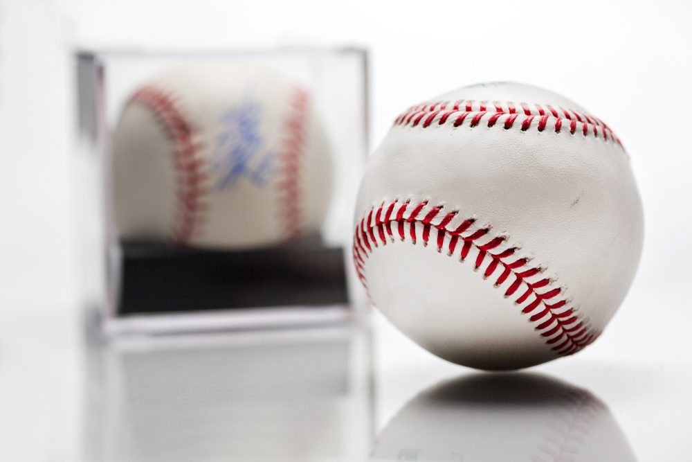 Signed baseball in glass case