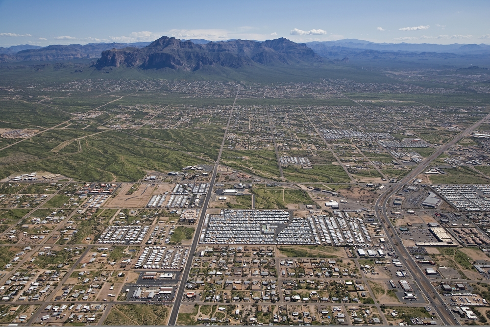 Aerial view of Apache Junction underneath the mountains