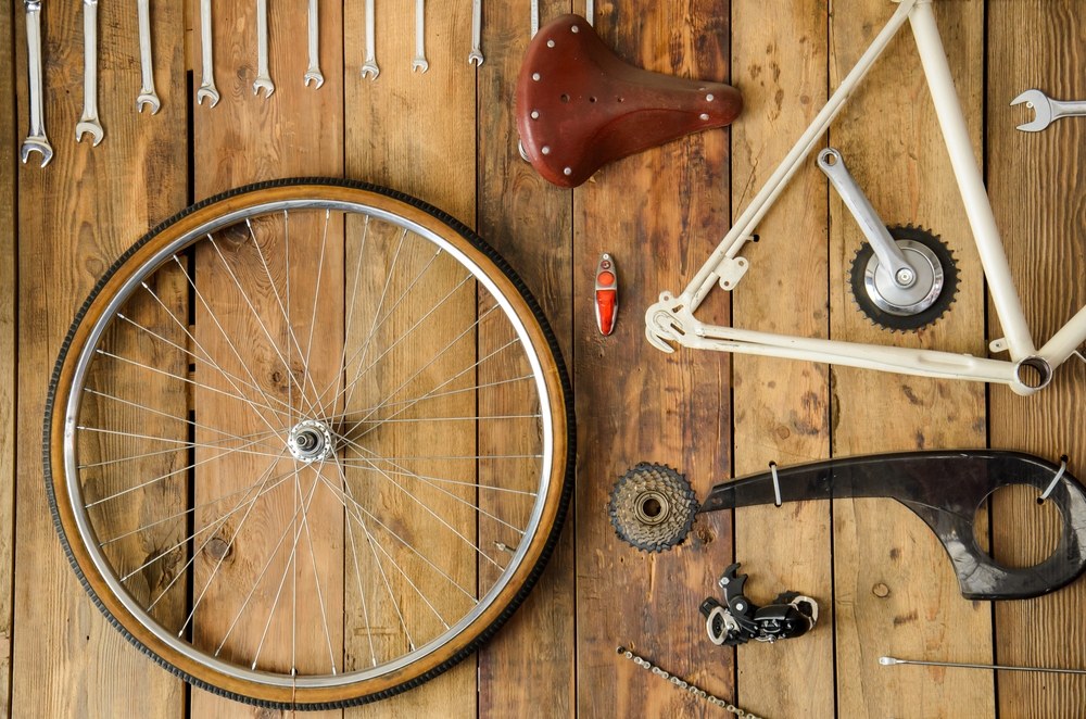 Parts of a bike disassembled on a wooden table