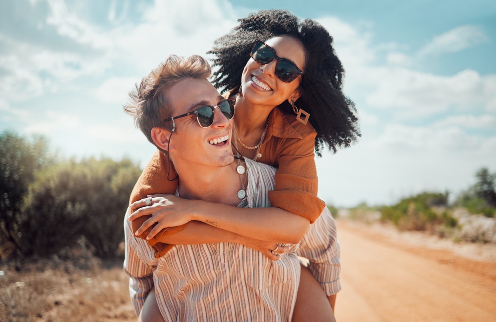 Happy couple walking through Arizona sun