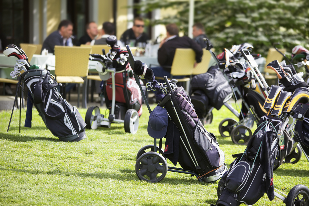 Several golf club bags lined up