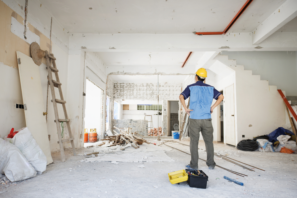 Person renovating home in a hard hat